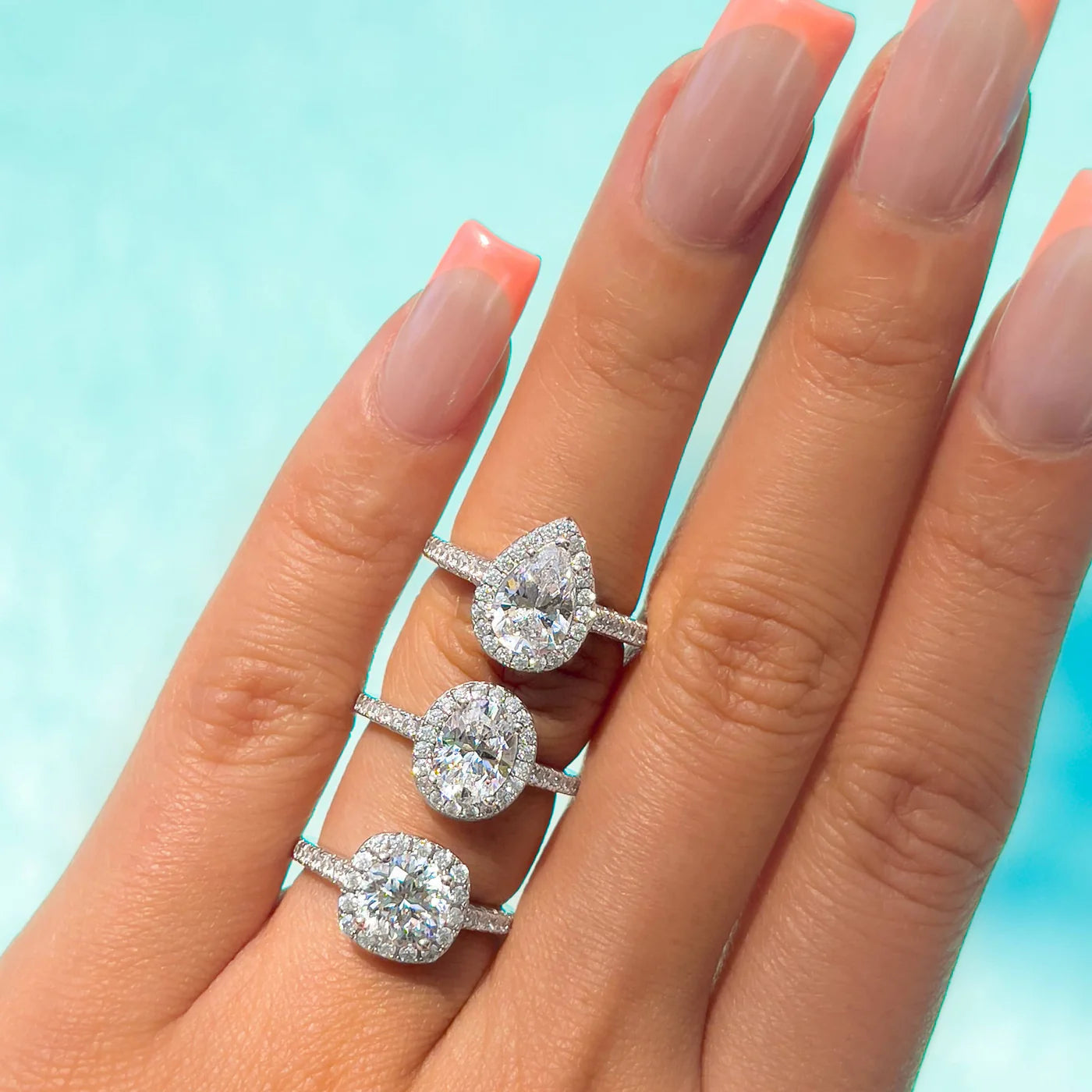 Bexley 1.5 ct. (8x6mm) Oval Moissanite Halo Engagement Ring with Side Stones