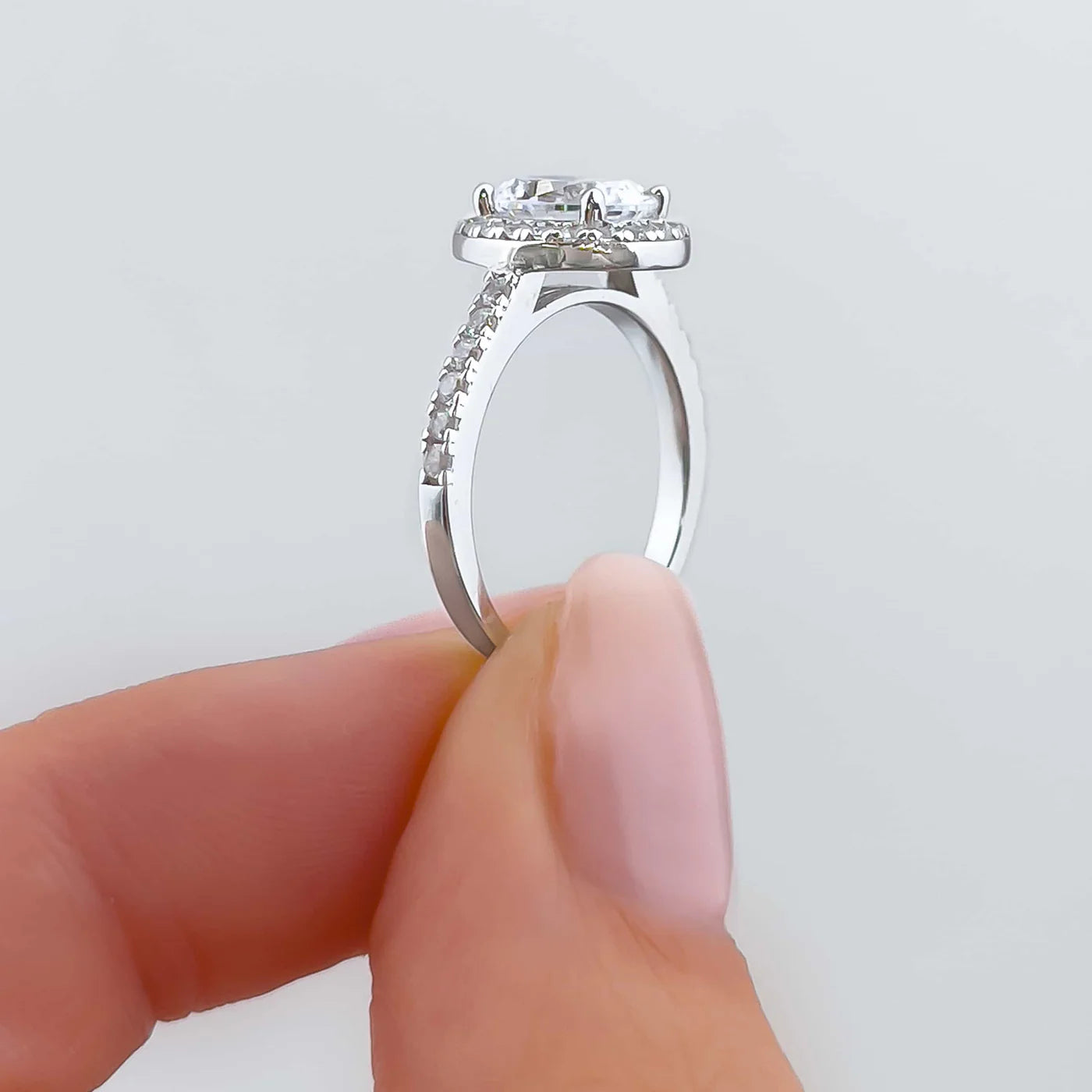 Bexley 1.5 ct. (8x6mm) Oval Moissanite Halo Engagement Ring with Side Stones