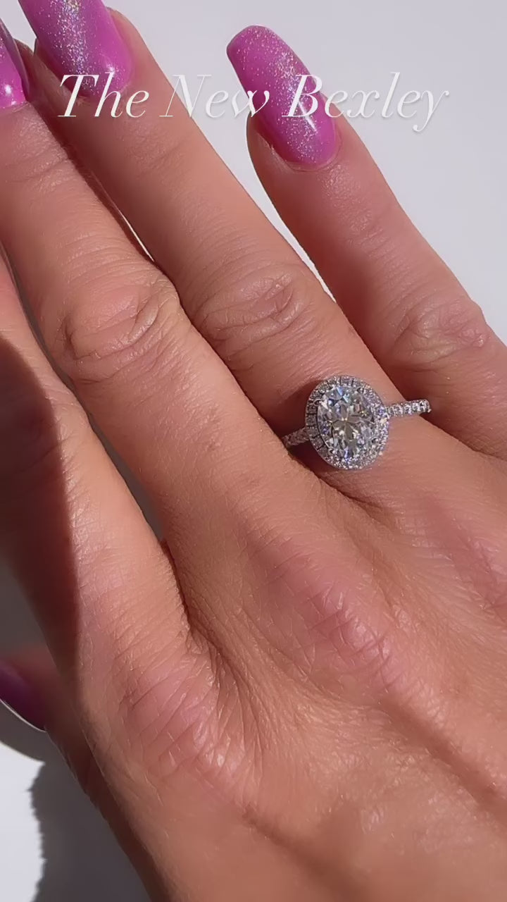 Bexley 1.5 ct. (8x6mm) Oval Moissanite Halo Engagement Ring with Side Stones