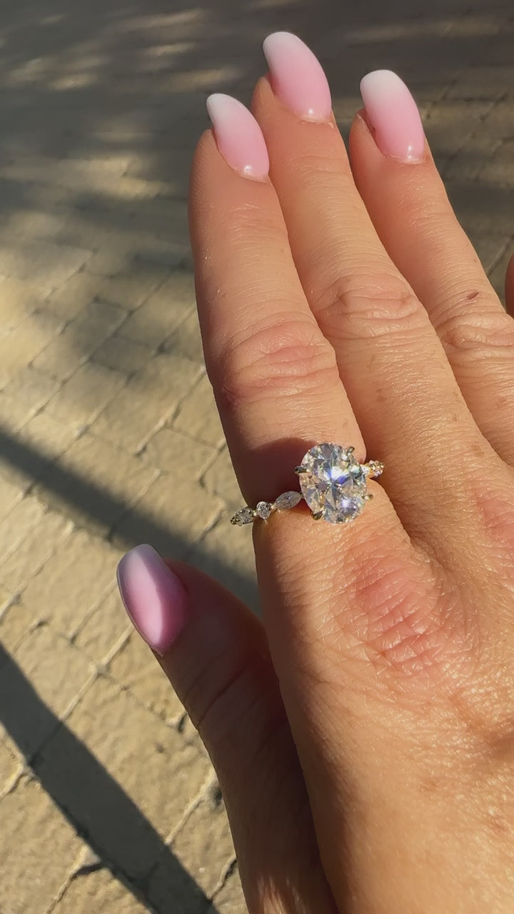 Layla 3 CTW DEW Brilliant Oval Moissanite Ring with Marquise & Round Side Stones